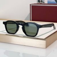 Black gold frame green lens