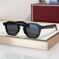 Black Amber frame grey lens
