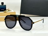 Black gold frame gray lens