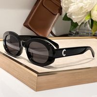 Black white frame grey lens