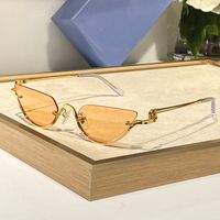 Gold frame Orange lens