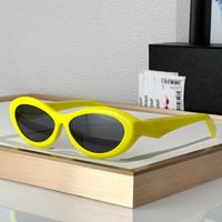 Yellow frame grey lens