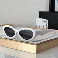 White frame grey lens