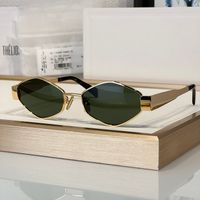 Gold frame green lens