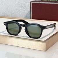 Black frame green lens