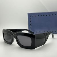 Black frame grey lens